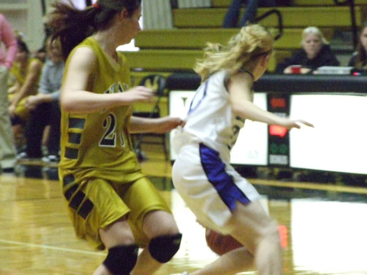 Image: Lion By The Tail — Italy’s #20 Danielle Baugher grabs a Lion by her shirt tail.