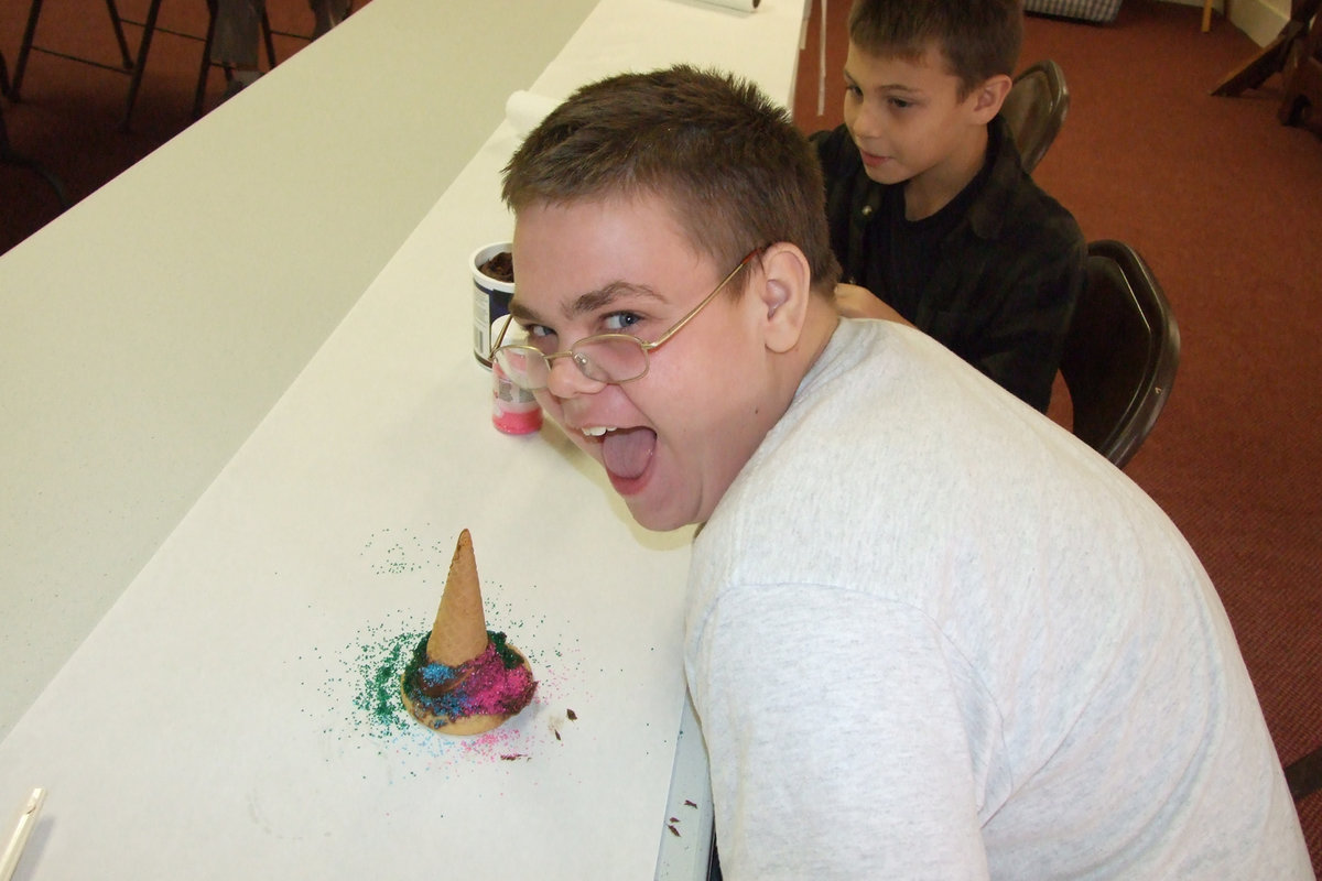 Image: William likes his hat — William Youngblood had fun making his clown hat.