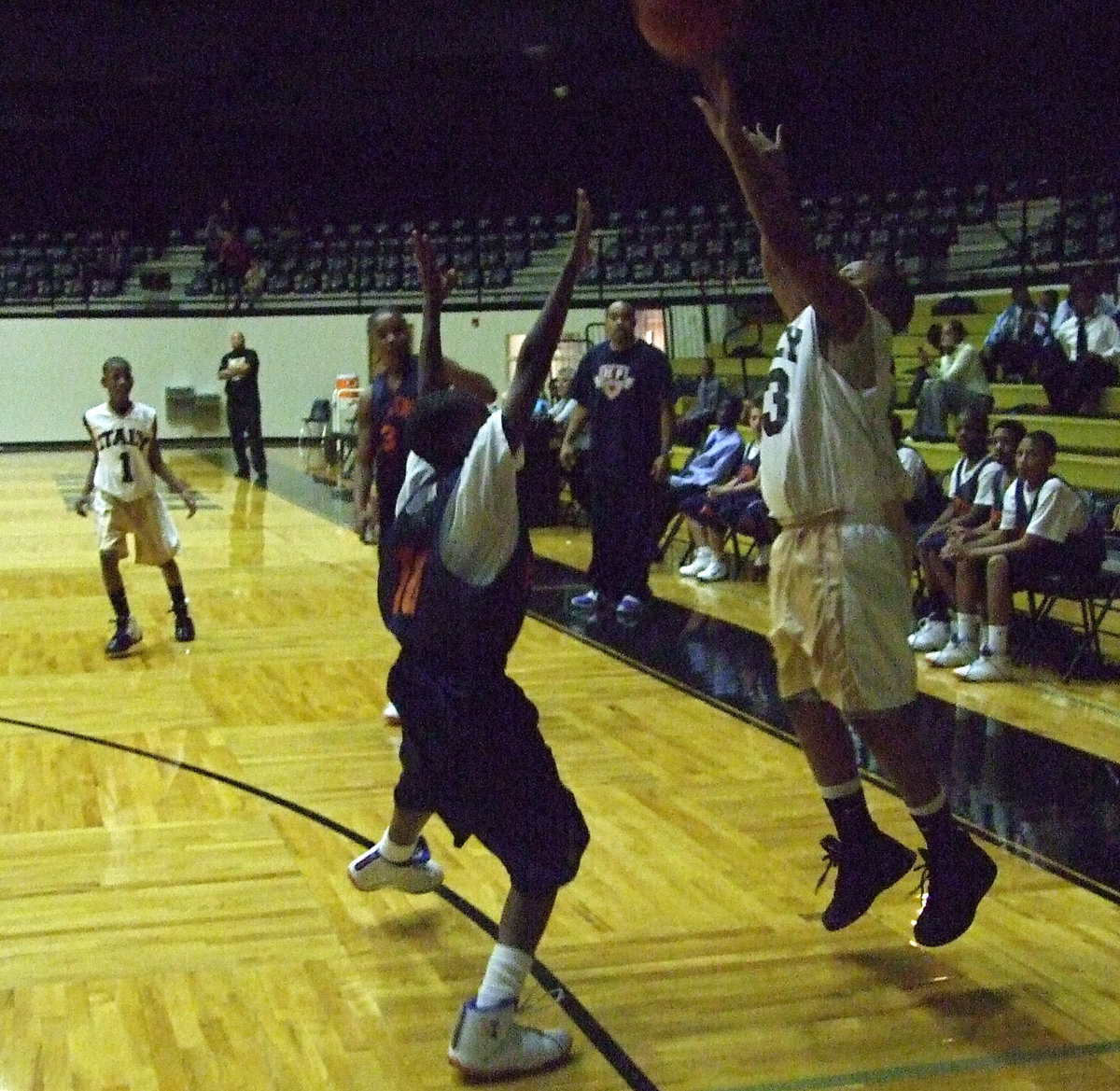 Image: No Pressure — Mayberry shrugs off the pressure from a Hampton defender and releases another 3-point attempt.