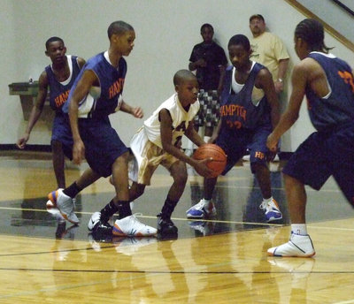 Image: Surrounded — Eric Carson #1 has these four players from Hampton surrounded.