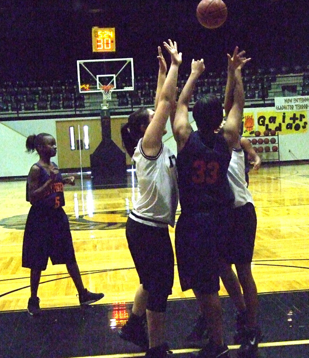 Image: Pass Block — Monserrat Figueroa #31 and a teammate try to slow down the Hampton fast break.