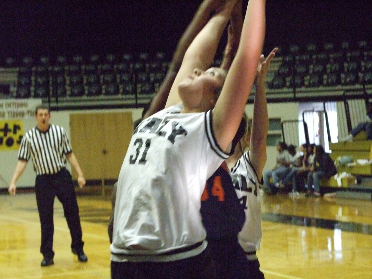 Image: Figueroa Fights For It — Monserrat Figueroa #31 battles for the basketball with a Hampton defender.