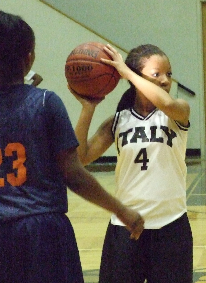 Image: Seeing The Floor — Italy’s #4 Ryisha Copeland scans the court for an open teammate.