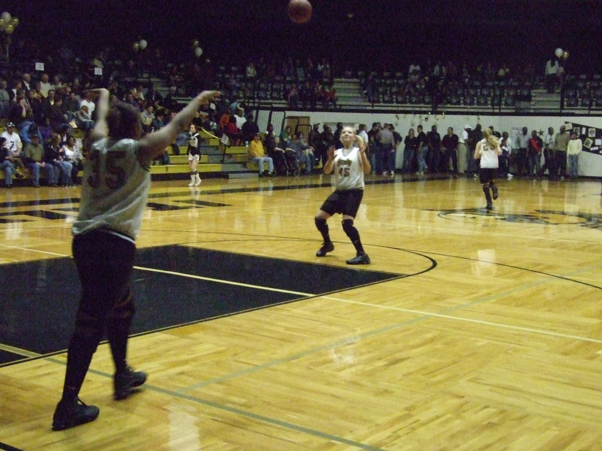 Image: Fleming and Richards — In the last few minutes of the game, the Lady Gladiators tried to take their time and not foul the other team.