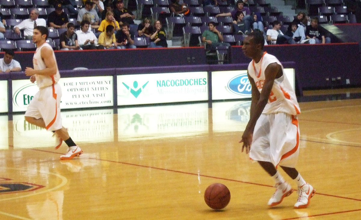 Image: Hughes Concentrates  — Senior #12 Dernard Hughes looks to make a play.