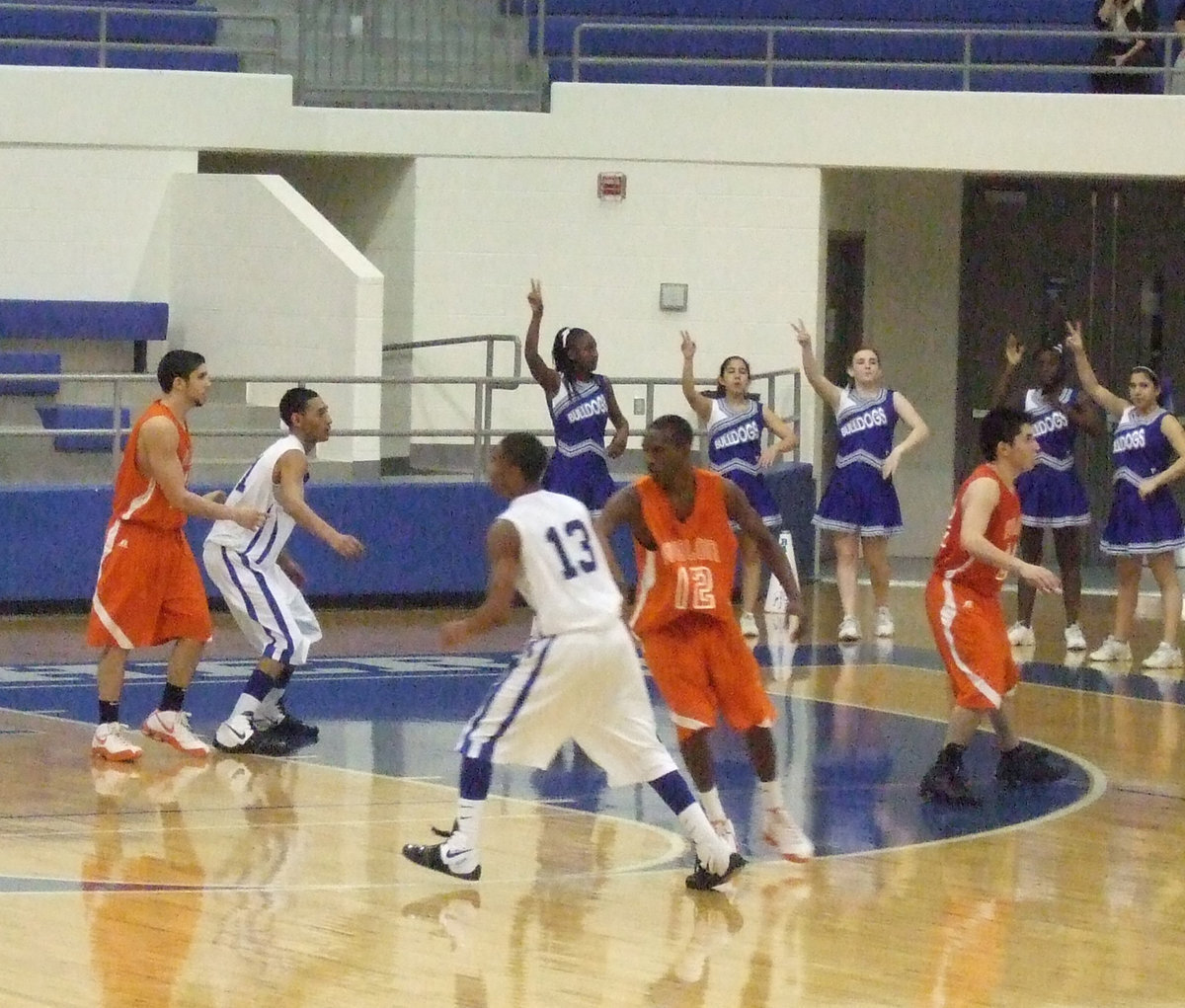 Image: Triple Trouble — Romero, Hughes and Mungia played powerful defense against Milford.