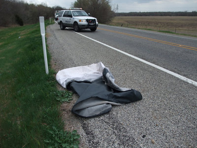 Image: Trailer tarp — A trailer tarp, that was flapping on the side of the road, marks the beginning of frightful accident.