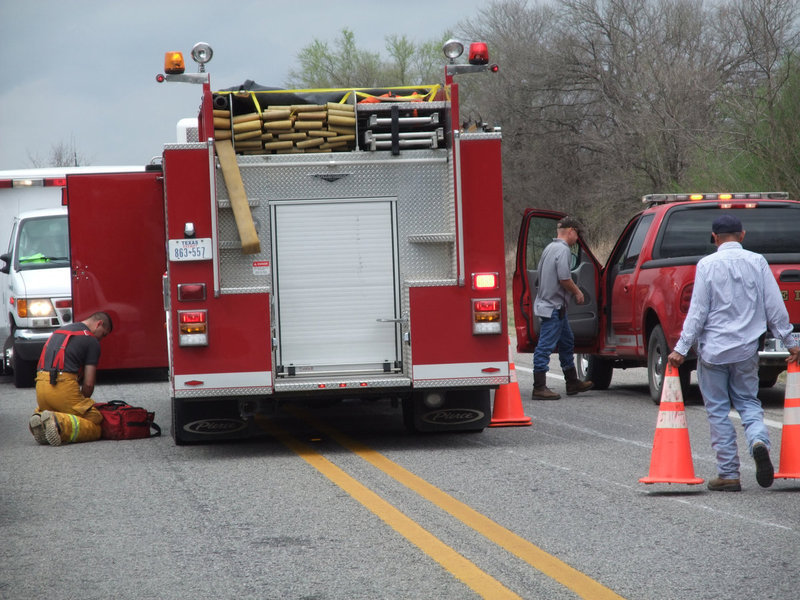 Image: I.F.D. packs gear — The Italy Fire Department begins the cleanup.