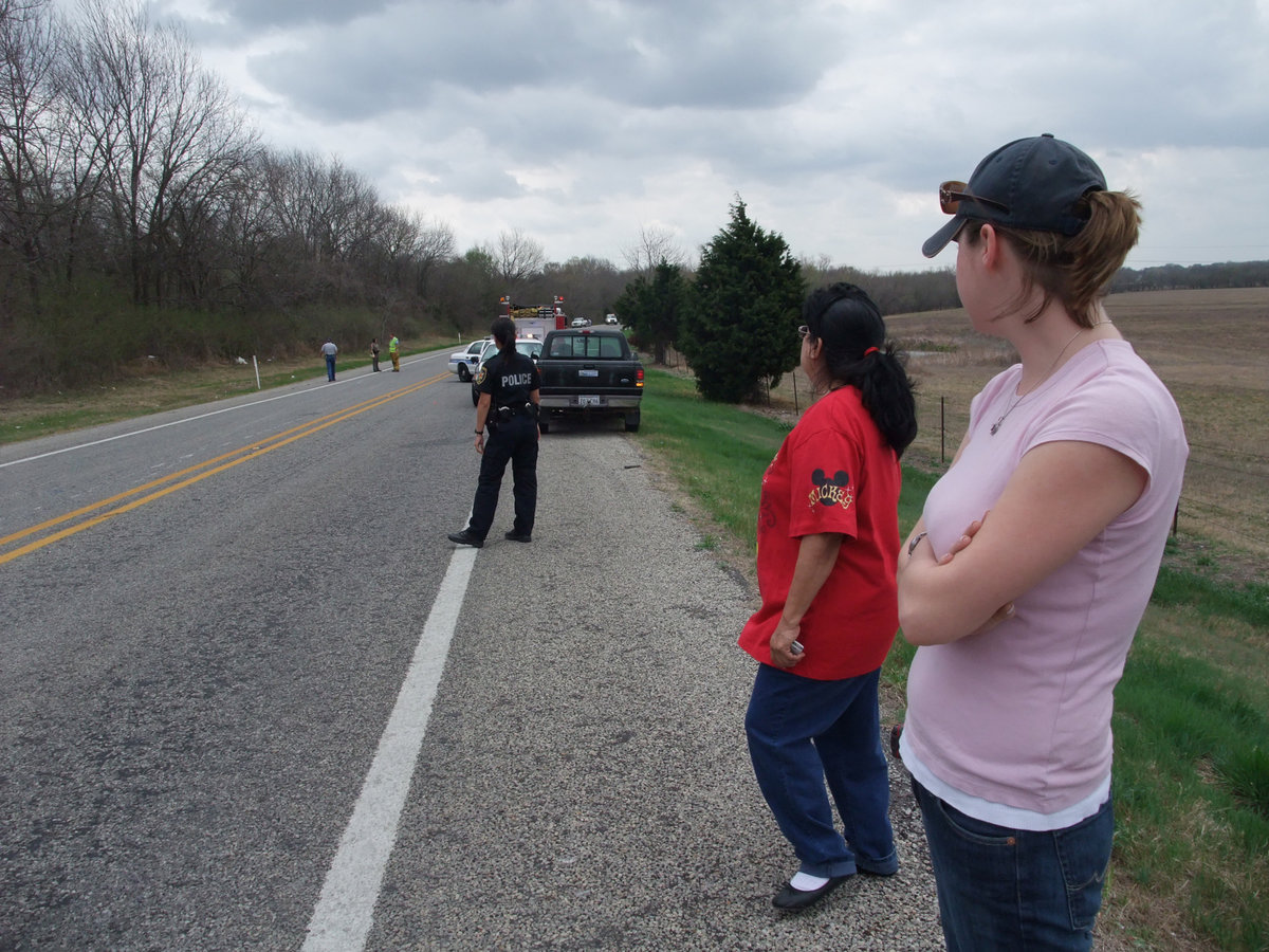 Image: Witnesses were helpful — Investigators begin marking the scene while the witnesses look on.