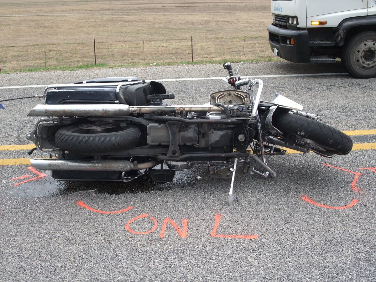 Image: Marking the pavement — The Highway Patrol marked the scene.