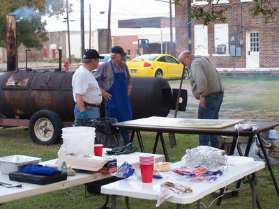 Image: Captain Murrie and his men — Murrie Wainscott, Dick Erwin and John Allen helped create world class brisket for the Round Up.