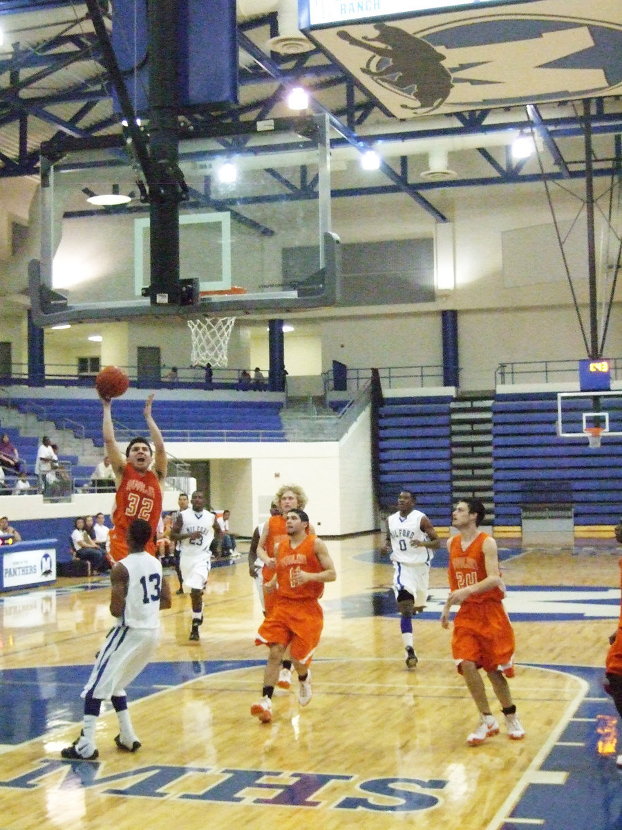 Image: 
    	Rodney Mungia — The high-flying Avalon Eagles become Regional Quarterfinal Champions after defeating the Milford Bulldogs 47-41 inside the Midlothian High School Gym.
    