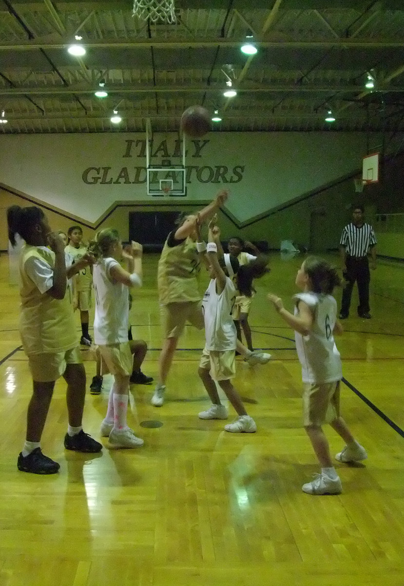 Image: Going for it — It was no boy’s land under the basket when these two Italy girls teams were battling.