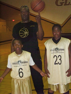 Image: The triple double — Head Coach Ken Norwood and his two sons are three of a kind.