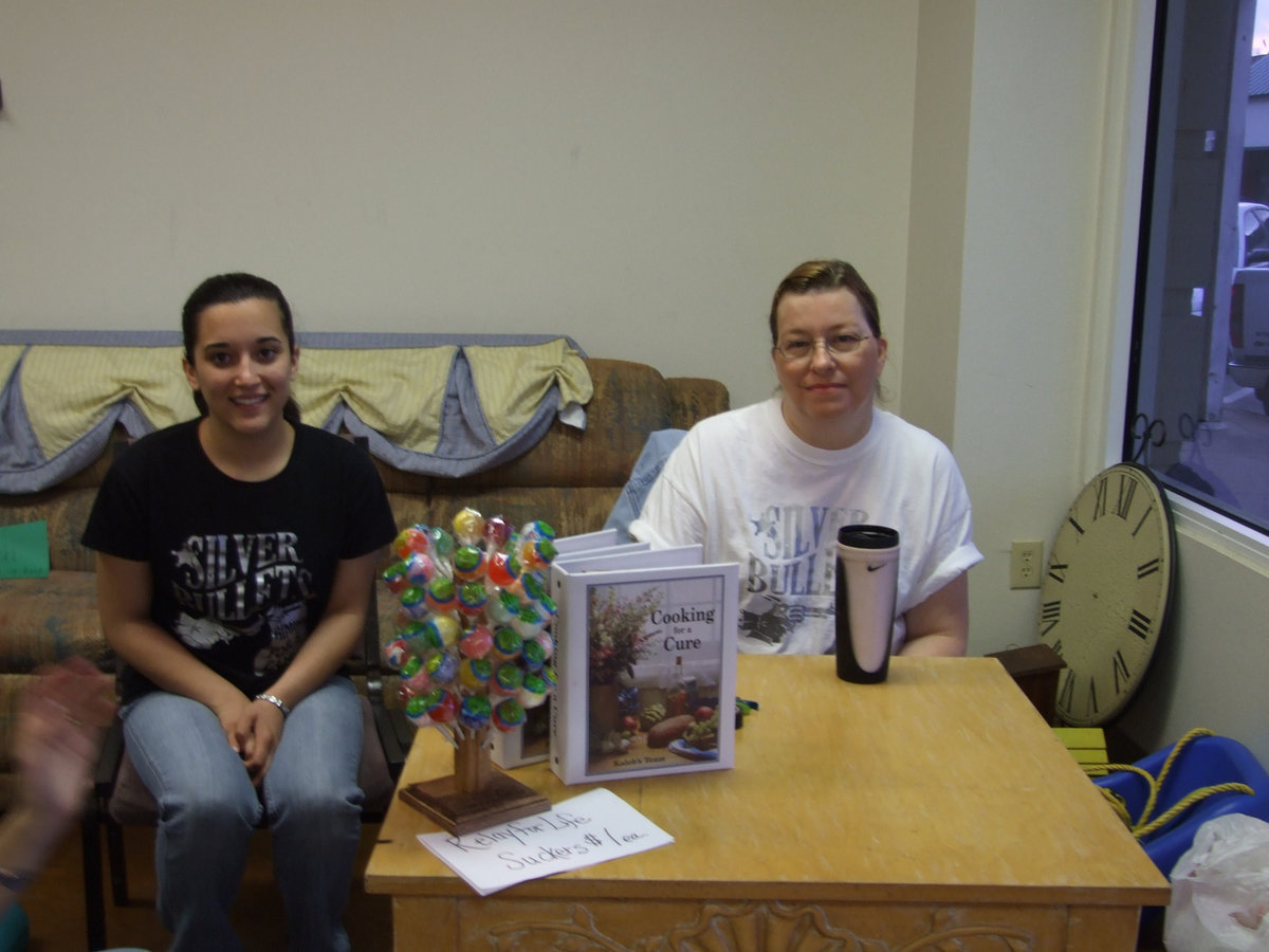 Image: Silver Bullets Team Members — Kasey Montgomery and Anne Sutherland were up bright and early greeting the many customers.