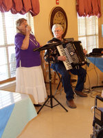 Image: Barbara and Rob Mazzola — Barbara and Rob singing Amazing Grace.