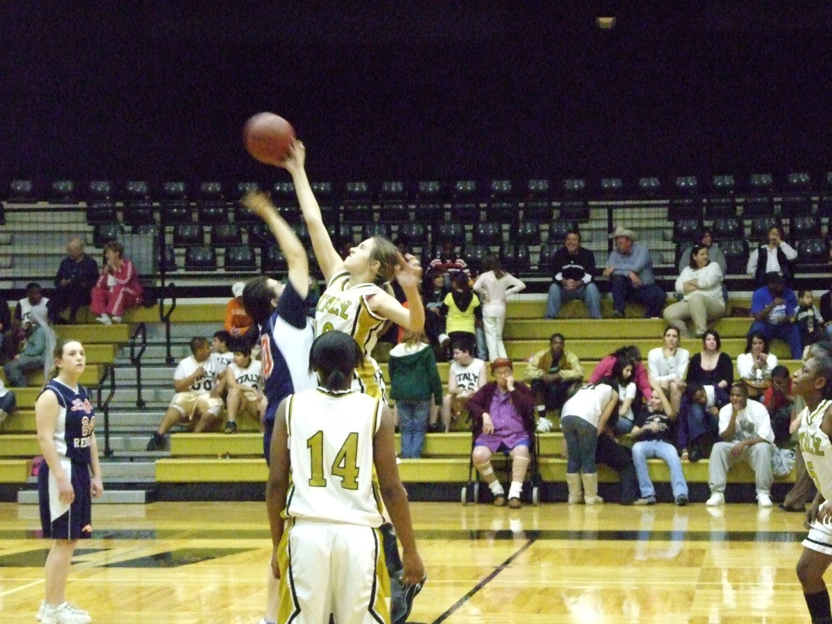 Image: Italy’s #10 Brianna Perry — Italy’s #10 Brianna Perry wins control of the tip as Italy’s 8th grade girls win in a route over Red Oak Life 34-4. Perry led all scores with 10-points.