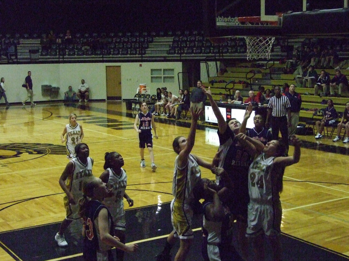 Image: On The Chin — Italy’s #24 Alyssa Richards takes it on the chin in order to get a rebound for her squad.