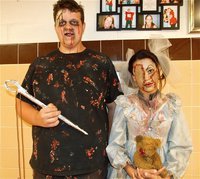 Image: Doll maker and his doll — The doll maker, Zac Mercer, and his scariest creation, Alex Minton.