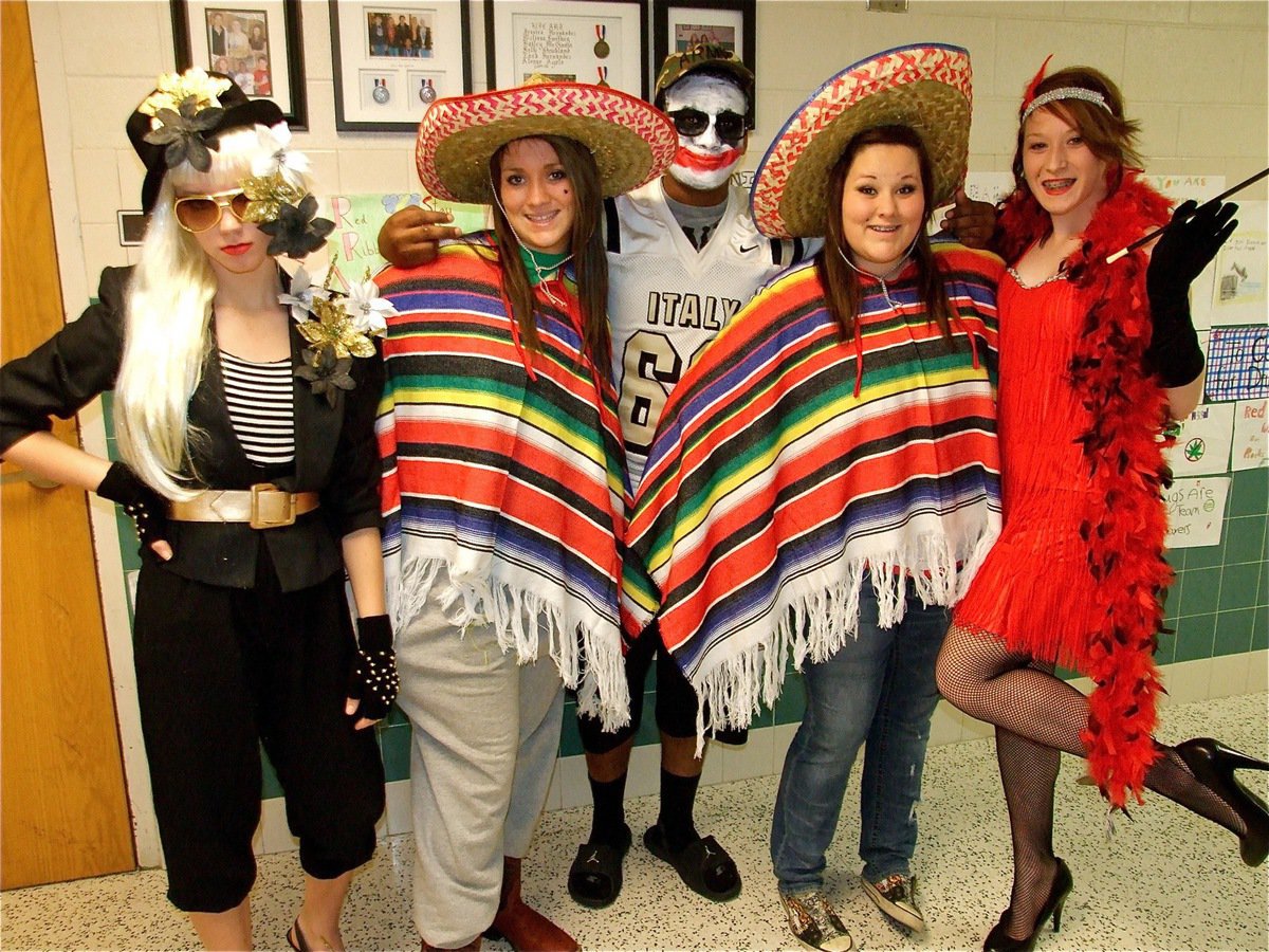 Image: In character — Sierra Harris as Lady Gaga, Breyanna and Chelsea Blake Beets as the “Sombrero Sisters,” Bailey “The Flapper” Bumpus and, in the back, De’Andre “Crazy Clown” Rettig.