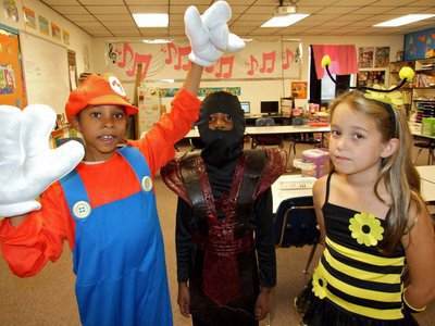 Image: Halloween fun! — Mario, a Ninja and a Grumble Bee. Sam Glover, Jaylon Lusk and Karley Nelson.