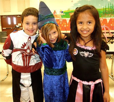Image: Cool costumes — Rocklin is a Power Ranger, Hailey is a wizard and Daniela is a girl bat.