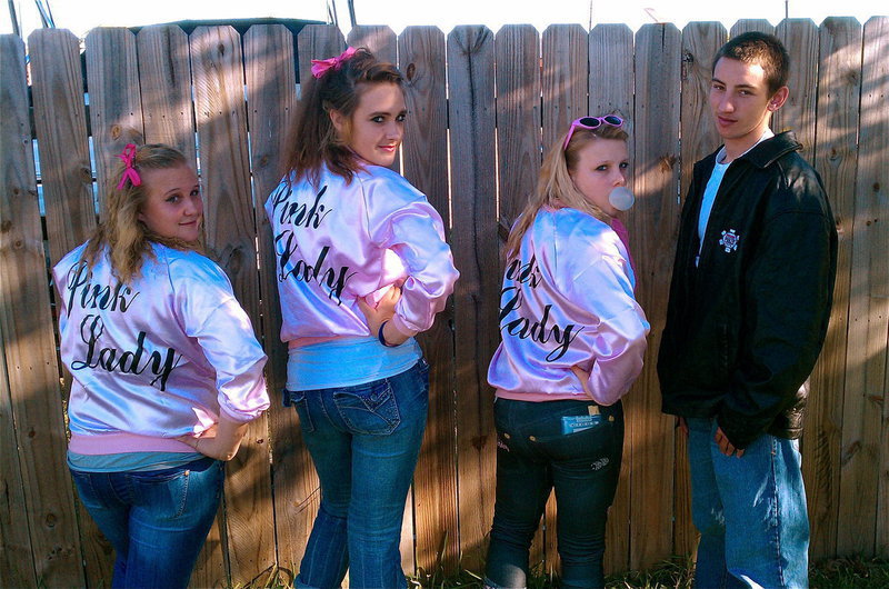 Image: Greased lightning! — The Pink Ladies, Drenda Burk, Brianna Perry and Casandra Jeffords, hang with Bubba Itson from the T-Birds.