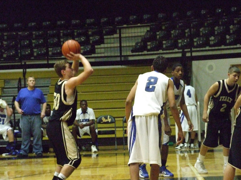 Image: Wilkins Wills It In — Looking down the barrel of free shot is Italy’s #50 Kyle Wilkins.