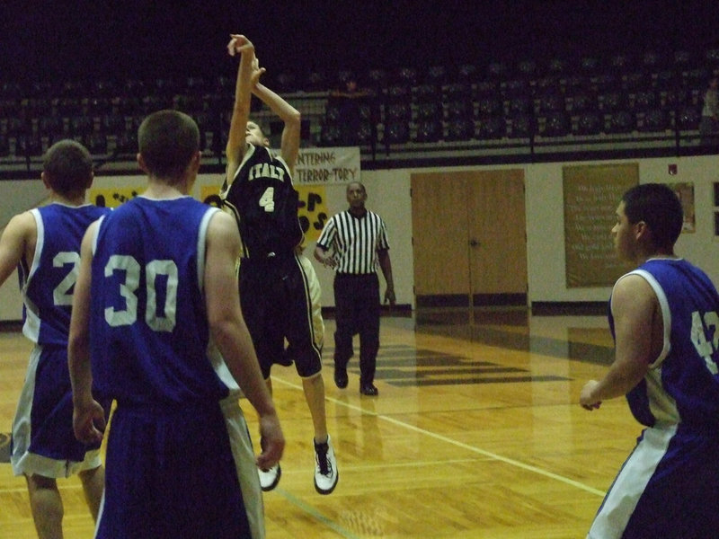 Image: Call The Calvary — Holden shoots from long range against Rice during 2nd round action.