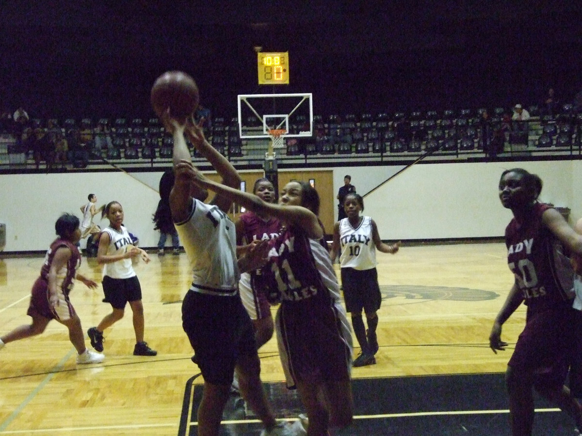 Image: Harper Fouled — Italy’s #5 Ashley Harper gets fouled in the paint.