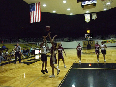 Image: From The Wing — Italy’s #4 Ryisha Copeland lets it fly from the wing over a Lady Eagle defender.