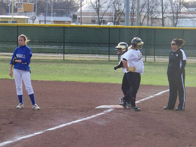 Image: Courtesy Runner — Lupita Luna comes in as a courtesy runner for catcher Julia McDaniel.