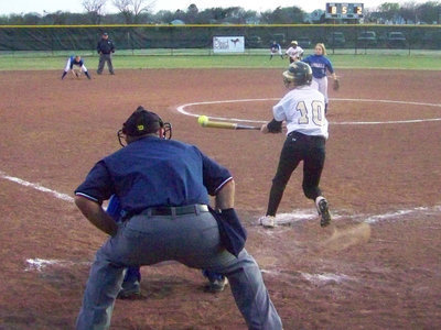 Image: Just misses — Courtney zigged when she should of zagged and just misses while attempting a drag bunt.