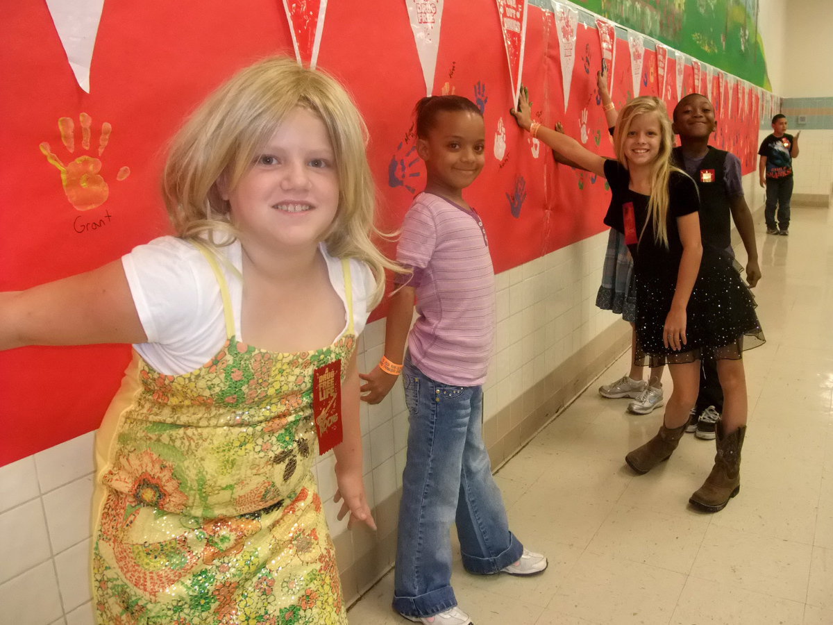 Image: Don’t Do Drugs — These students are pledging not to do drugs and sealing their pledge with their hand print.