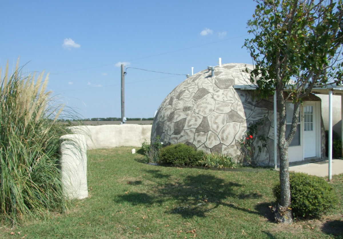 Image: Compare strawbale fencing to concrete fencing — This dome rental is surrounded with strength.  This R&amp;D park tests everything that comes down the road.