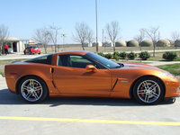 Image: Corvette — This bright orange Corvette participated in the rally.