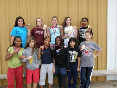 Image: 7th Grade Girls — The 7th Grade Girls 2009 Track Team poses for pictures and displays their awards from the Dallas Gateway track meet.