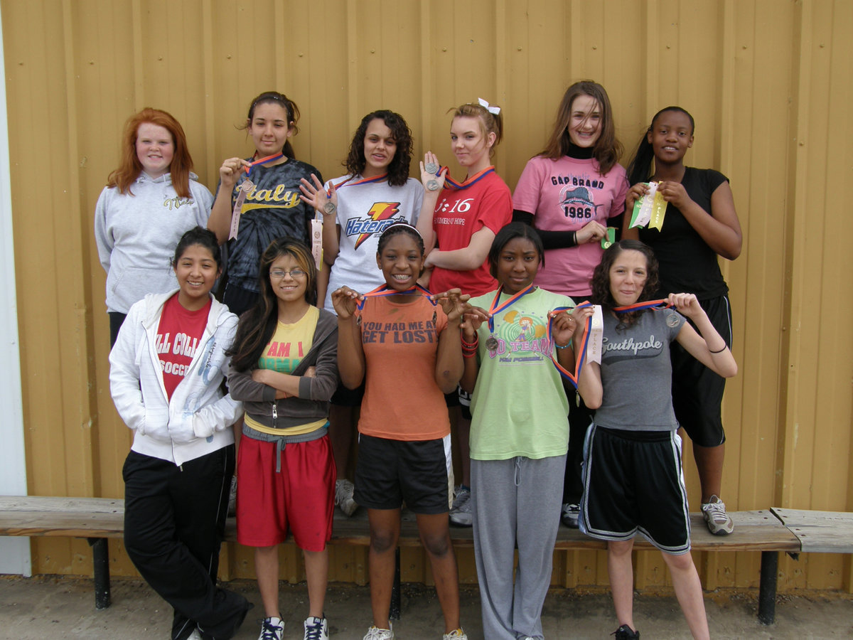 Image: 8th Grade Girls — The 8th Grade Girls 2009 Track Team is loving every minute of it as they show-off their winnings from the Dallas Gateway track meet.