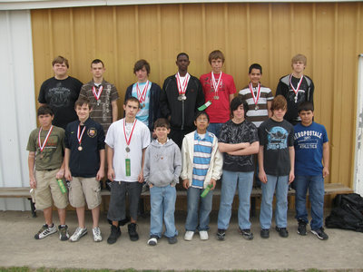 Image: 8th Grade Boys — The 8th Grade Boys 2009 Track Team slows down for the camera and displays their medals and ribbons from the Panther Relays in Maypearl.