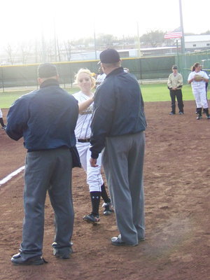 Image: Megan “Rich” Richards — After greeting the umpires, Megan enters the field to take her defensive position.