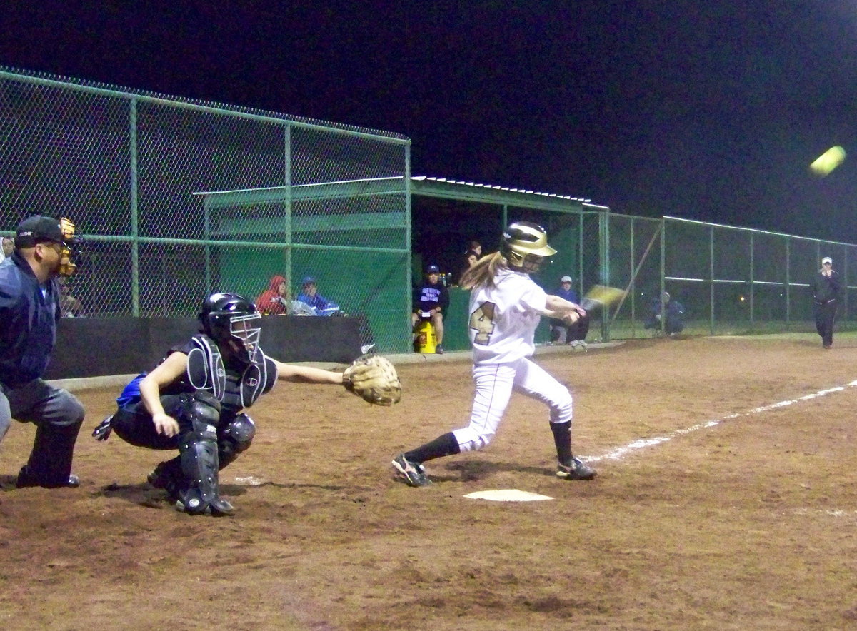 Image: A Shot — Drew Windham connects with the ball.