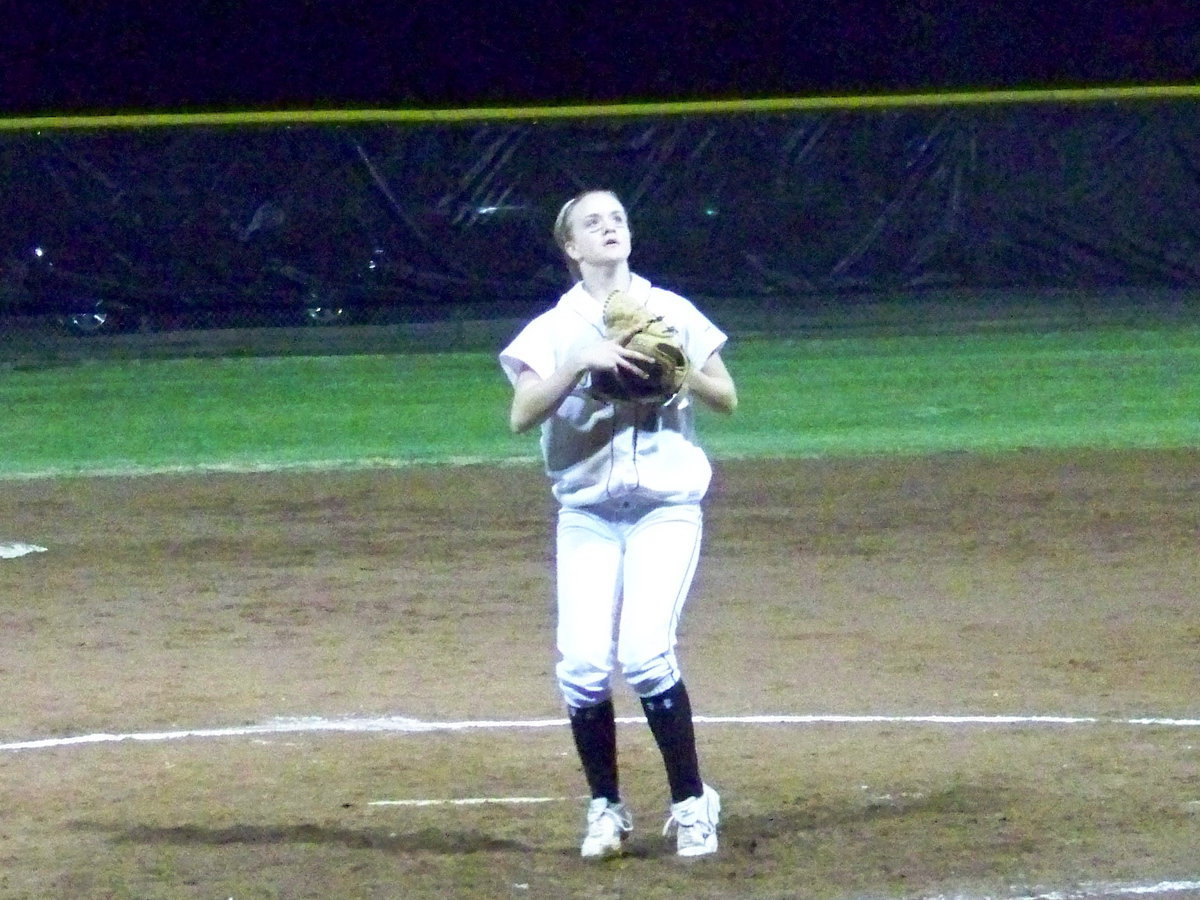 Image: Setting up — Courtney Westbrook sets-up to catch a fly ball.