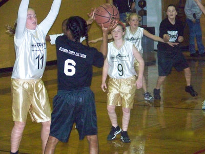 Image: D-fense! — Madison, K’Breona, Tara and Hannah play defense against Hillsboro.