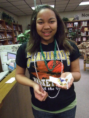 Image: Another Lucky One — Destani Anderson also found a baby in her slice of King Cake.