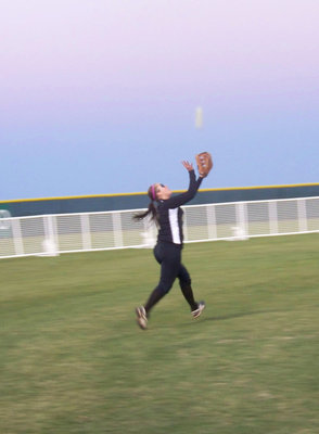 Image: “Jelly” making the catch — Angelica Garza catches a fly ball during outfield warm-ups before the game.