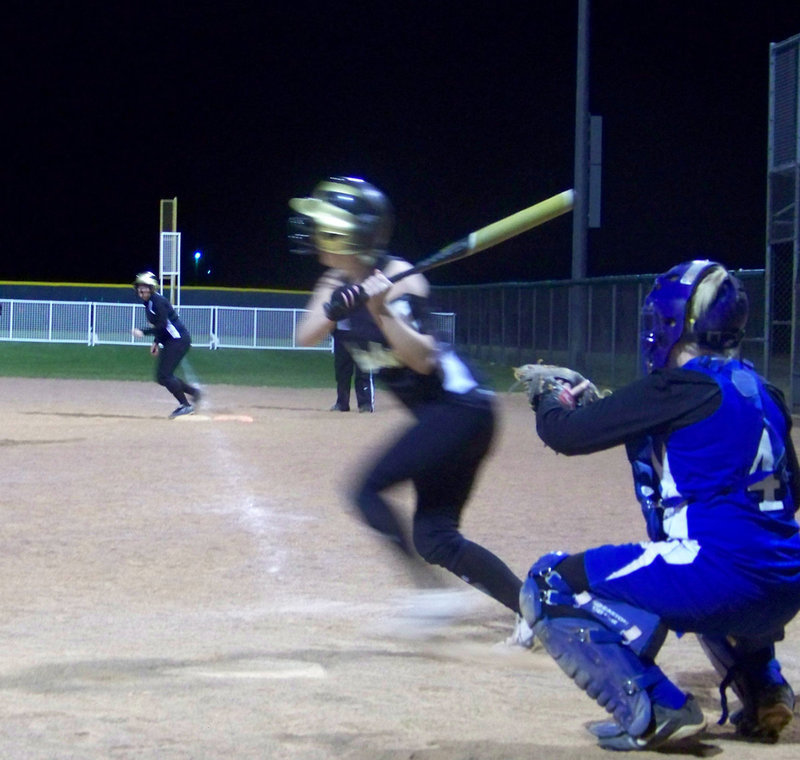 Image: In motion — Courtney Westbrook executing “the slap” from the left side of the plate.