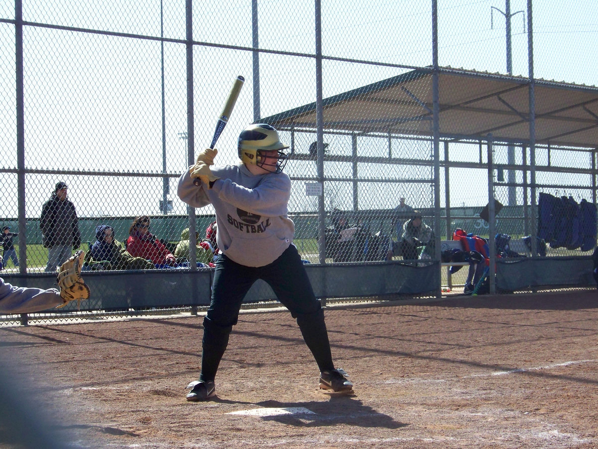 Image: “Rip-It” — Julia McDaniel, donning her hay hauling gloves, is up to bat!