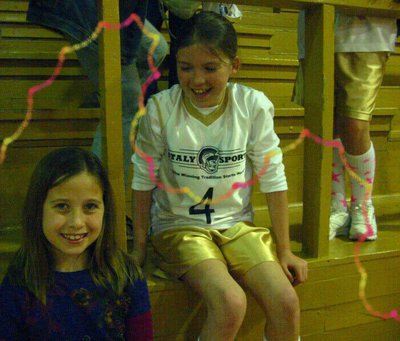 Image: All smiles — Grace Haight #4 and her little sister, Hannah Haight, are enjoying the victory celebration.