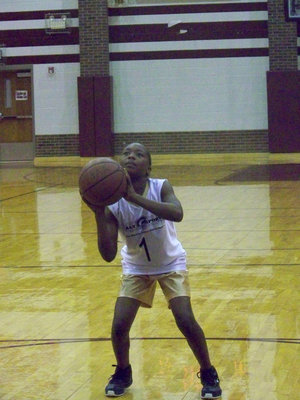 Image: Concentration — KaBreona Davis takes a practice free throw before the game against Hillsboro Red.