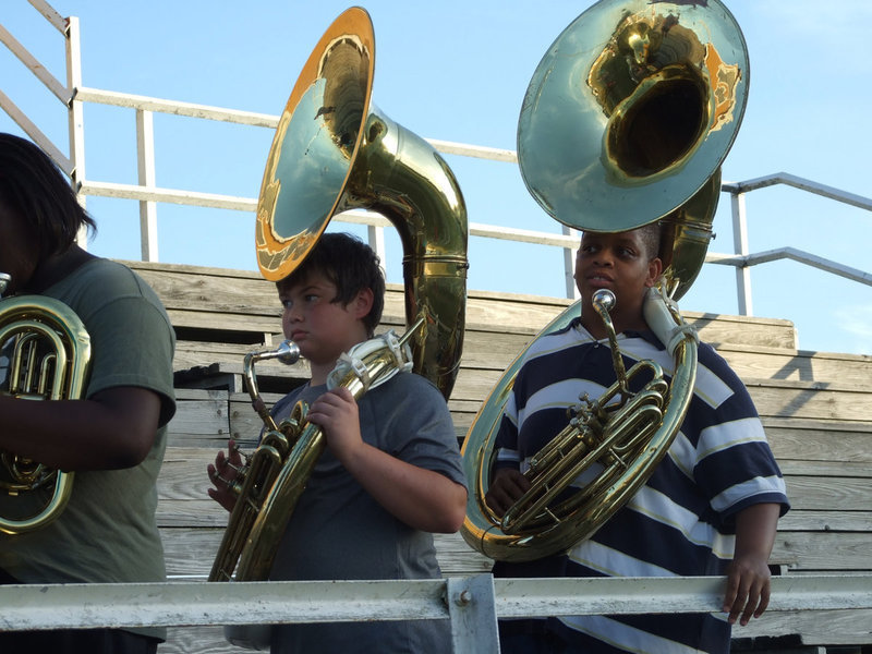 Image: Tuba time — Zain Byers and Timothy Fleming get ready for Friday night’s game.